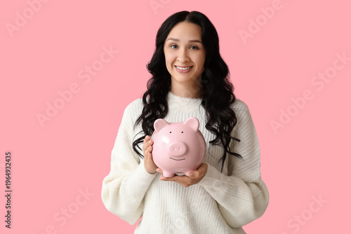 Pretty young woman with pig...
