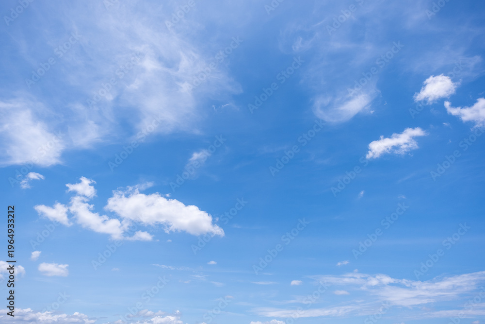 Fototapeta premium clear blue sky background,clouds with background, Blue sky background with tiny clouds. White fluffy clouds in the blue sky. 