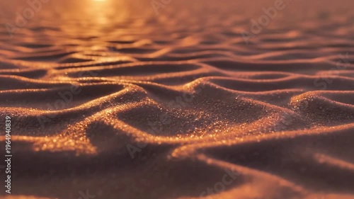 A serene desert landscape with intricate sand patterns illuminated by warm sunlight
