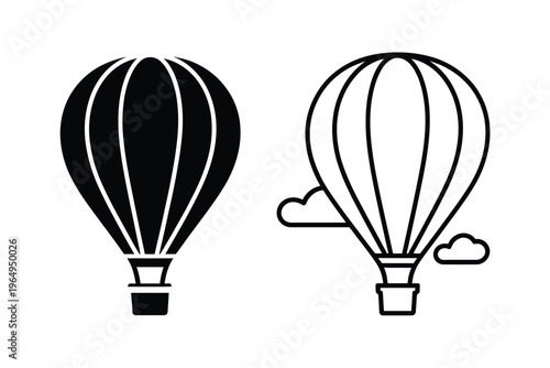 Two hot air balloons one black and one white side by side