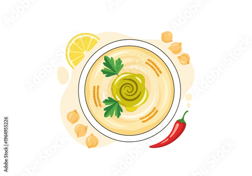 A hummus dish in a white bowl garnished with parsley a swirl of olive oil chickpeas lemon slice and red chili pepper