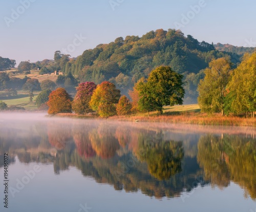 Wallpaper Mural Lakeside Autumn Landscape: A serene landscape mirrors a vibrant autumn scene with lush trees in various seasonal hues reflected in a tranquil lake, under a clear, crisp sky. Torontodigital.ca