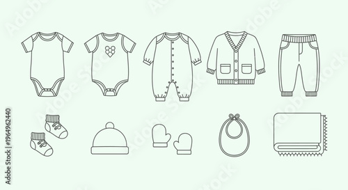 Baby clothes and accessories laid out.