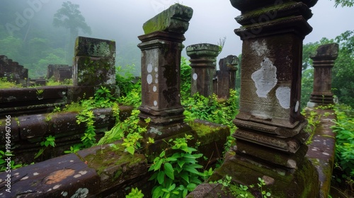 Ancient Ruins Overgrown with Green Vegetation in Misty Forest Landscape at Foggy Dawn