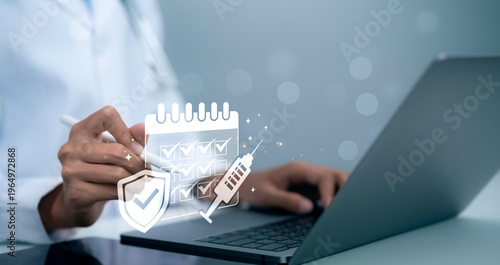 Billede på lærred Vaccination schedule healthcare protection concept doctor hand using laptop with