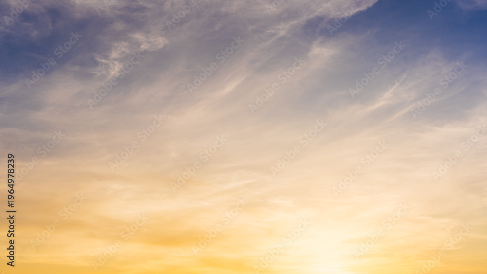 Obraz premium Golden Sky, Sunset sky cloud in summer Evening with Orange, Yellow, Blue sunlight, Horizon nature Golden hour Warm morning sunrise sky Background