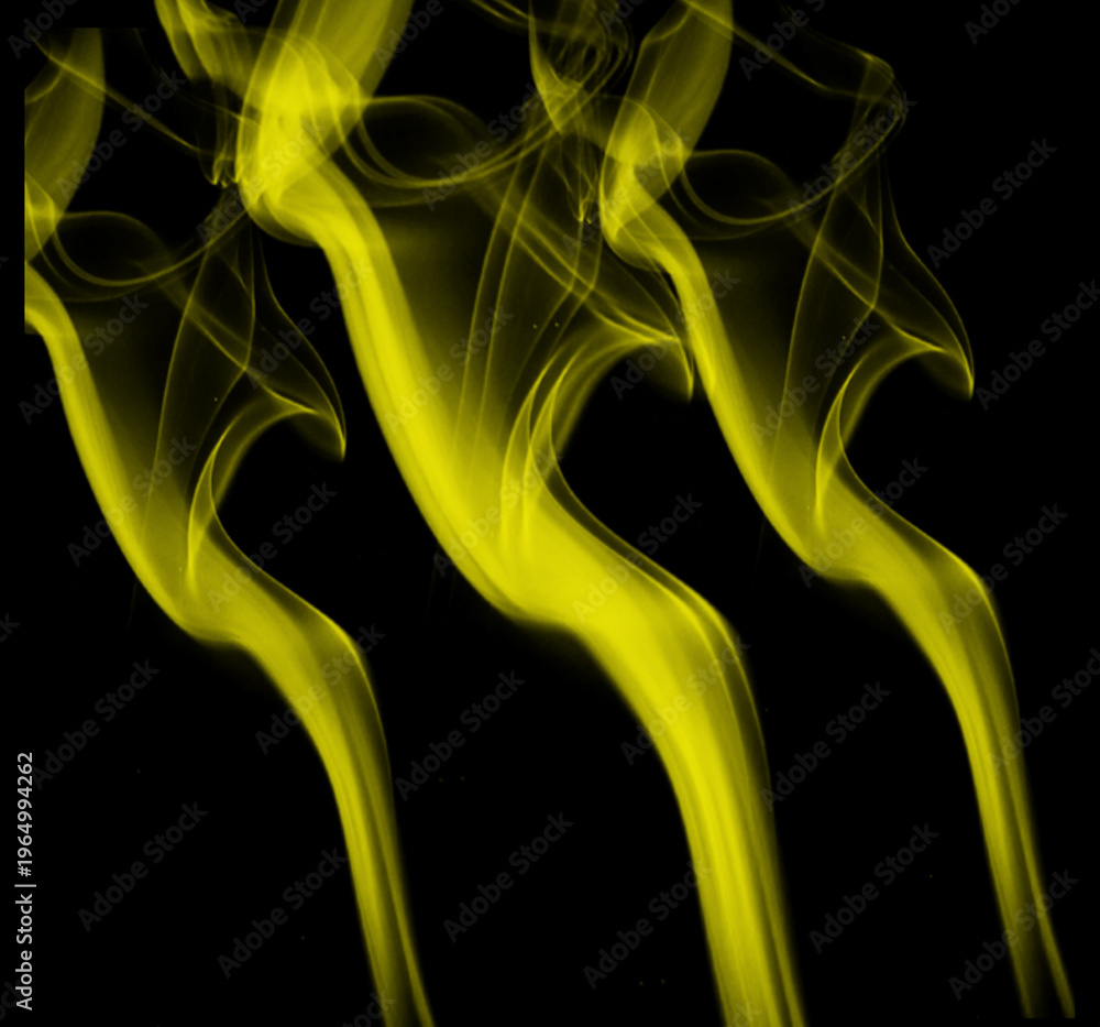 Obraz premium yellow smoke trails on black background