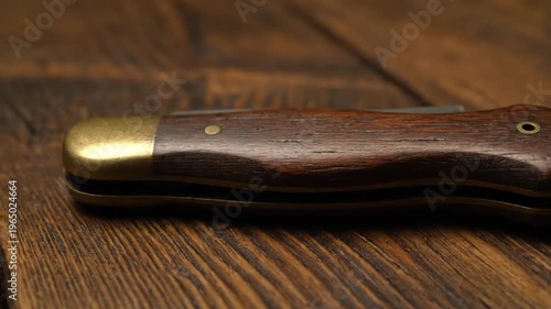 Old Pocket Knife on Wooden Table Close Up Vintage Utility Tool