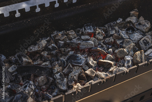 Hot coals are in the grill