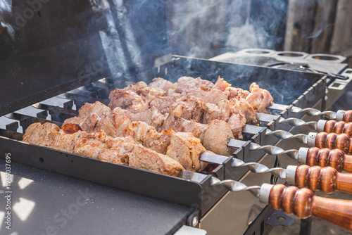The meat is grilled outside on a barbecue