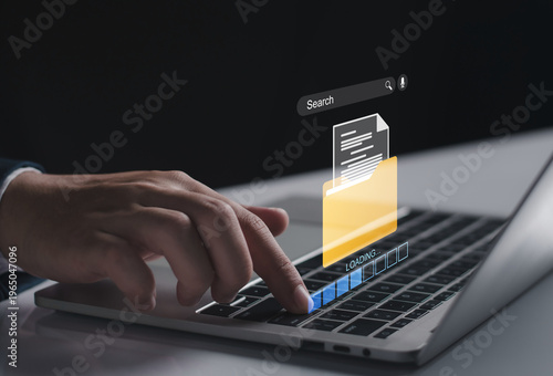 Businessman using a laptop with a digital search bar, folder icon. data retrieval, digital archiving, document management systems DMS, and professional information searching in corporate environment.