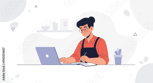 Young person with glasses studying and working on a laptop at a desk