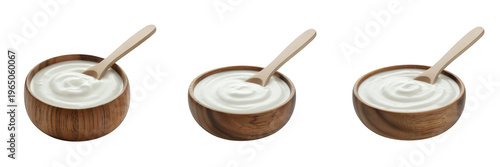Three wooden bowls of yogurt on black spoons white isolated on a transparent background