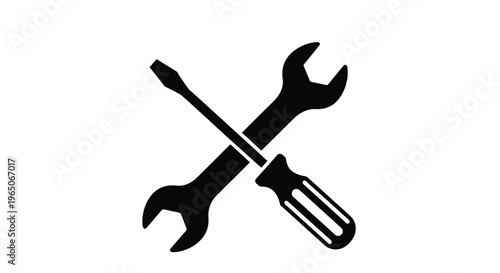 A crossed arrangement of a wrench and a flathead screwdriver