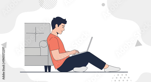 Man Working on Laptop While Sitting on Floor Next to Sofa