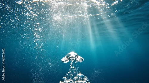 Aerial view of skyscrapers and buildings in a cityscape during sunset with clouds and a tall tower standing out