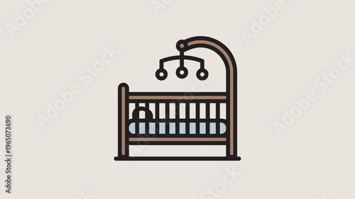 A simple brown baby crib with a mobile and teddy bear inside on a beige background