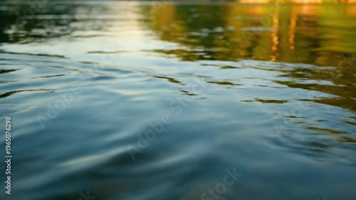 Aerial view of skyscrapers and buildings in a cityscape during sunset with clouds and a tall tower standing out