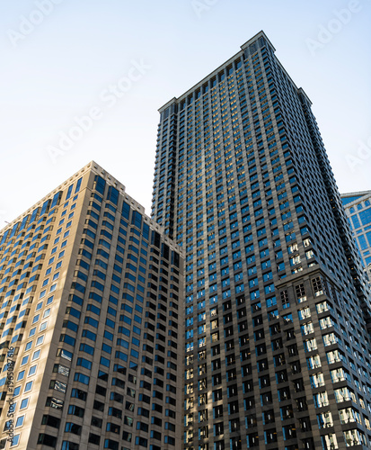 Reflective glass architecture. Architecture in business center. Building architecture. Business building. Glass building. Business city. City architecture. Modern glass building