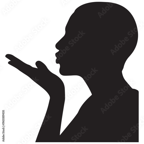 Silhouette of a person blowing a kiss profile view with hand to lips for love and romance concept