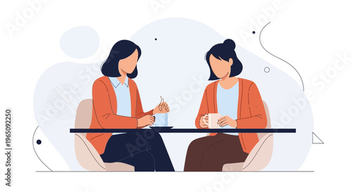 Two women friends enjoying coffee and conversation at a cafe table