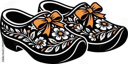 Dutch wooden clogs with orange ribbons and blooming flowers
