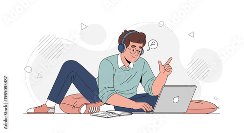 Young man with headphones learning online on laptop, sitting on floor with pillows