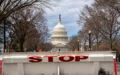 Stop barrier restricting access near Capitol. Government shutdown crisis at Capitol Hill. Political tension in Washington DC government. Federal budget stalemate problem.