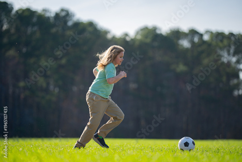 Canvas Print A child is playing football