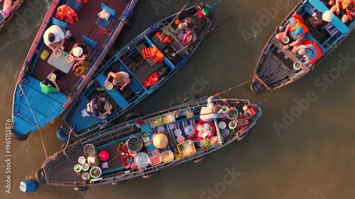 Aerial view of Cai Rang floating market, Can Tho, Vietnam. It is famous market in Mekong Delta, Vietnam. Tourists have breakfast on a boats, buy and sell food, vegetable, fruits on boat, ship