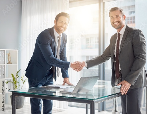 Business Handshake and Agreement Between Two Professional Men in Modern Office After Meeting
