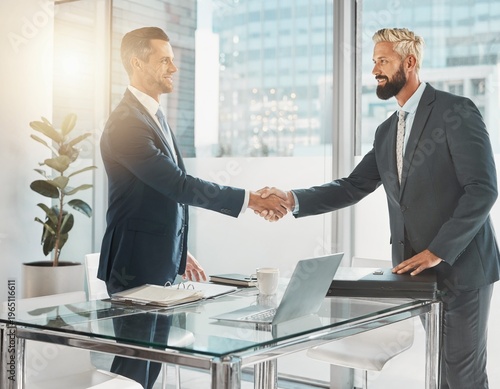 Business Handshake and Agreement Between Two Professional Men in Modern Office After Meeting