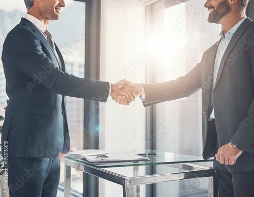Business Handshake and Agreement Between Two Professional Men in Modern Office After Meeting