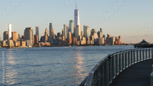 New York City Manhattan Downtown Financial District skyline, World Trade Center tower from New Jersey, Hoboken pier, United States of America. River waterfront urban cityscape with skyscraper building