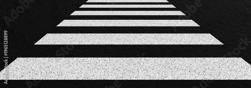 Perspective view of zebra crossing with white pedestrian stripes on dark asphalt road surface