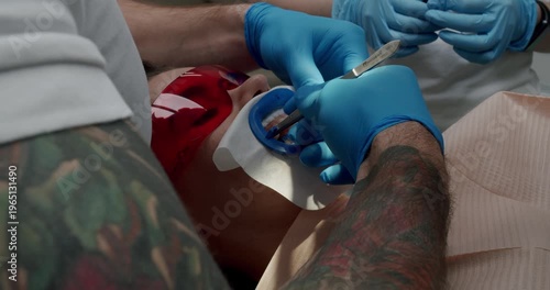 Dentist making tooth cleaning for patient in dental modern clinic. Modern dental clinic. Oral hygiene and prophylactic cleaning. Teeth Cleaning Ultrasonic Scaling.