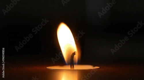 Candle Flame Flickering on Table Close Up Warm Romantic Light Detail