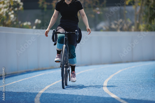 Photography Woman riding road bike at the outdoor stadium