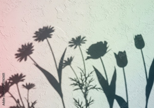 A minimalist art piece featuring dark silhouettes of various wildflowers against a light background