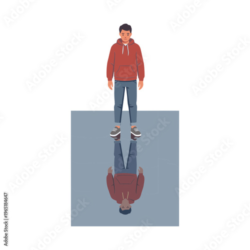 A man stands on a gray surface with his reflection staring upwards.