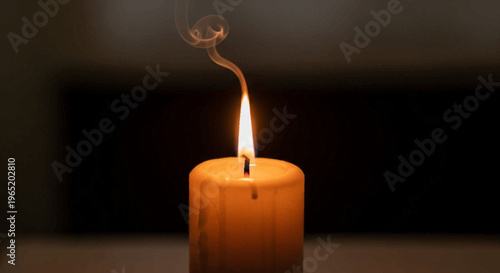 A single lit candle with smoke.