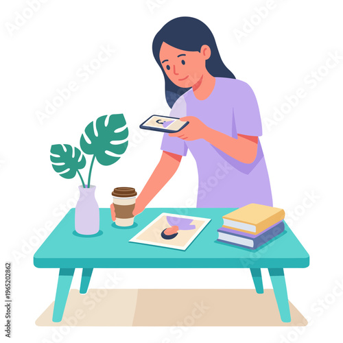 Woman sitting at a table examining a tablet with books and coffee nearby indoors