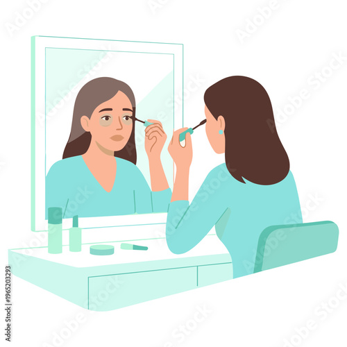 Woman applying mascara to eyelashes while sitting at a vanity table looking into a mirror