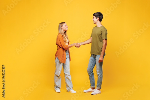 Bilde på lerret Full body side view young smiling fun couple two friends family man woman wear c