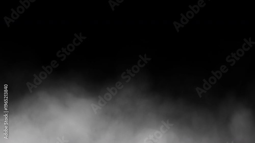 Cinematic fog or smoke billowing across the ground against a black background. Seamless animation in 4K resolution.