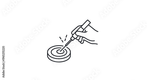 Close-up of a hand holding a soldering iron, working on a circular electronic component.