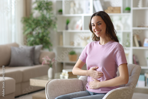 Happy woman with healthy intestinal tract looks at you