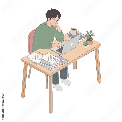 A young man studies intently on his laptop at a desk indoors