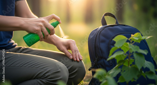 Person applying insect repellent on arm while sitting outdoors  