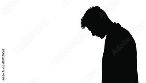Profile silhouette of a young man looking down in contemplation or sadness isolated on white.